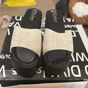 Brand New Fashion wedges size 42 and they linen material classy and stylish.